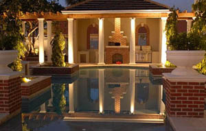 A summer kitchen with wood fired pizza oven and trellis by our orlando general contractor